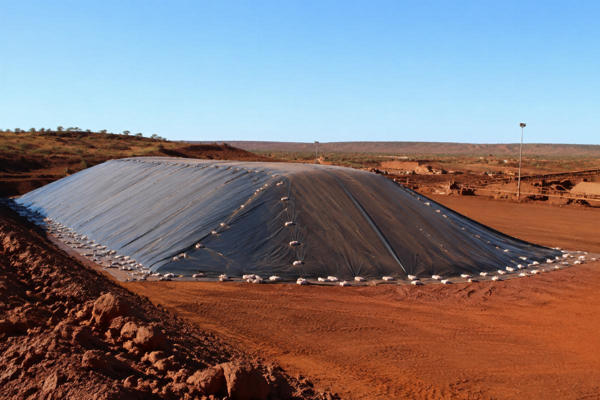 Heavy duty mining tarp covering bulk ore stockpiles at an Australian remote site